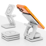 Valkoinen taittuva langaton latausasema käytössä iPhonen ja AirPodsien kanssa